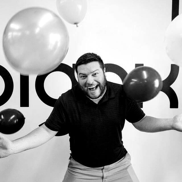 Chris Bell, business development manager dancing with balloons