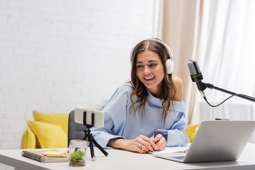 Brunette hosting a podcast